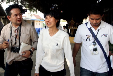 Thai espionage convict Ratree Pipattanapaiboon, center, leaves Prey Sar prison on Friday after receiving a Royal Pardon. (Siv Channa)