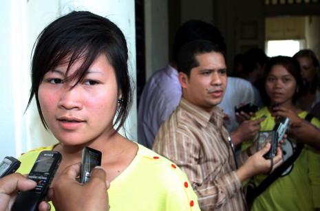 Keo Nea, 19, one of three garment factory workers who were shot and injured during a protest last year, speaks to reporters after the Appeal Court on Monday ordered that Chhouk Bundith, a government official and former governor of Bavet City, stand trial for the triple shooting. (Siv Channa)