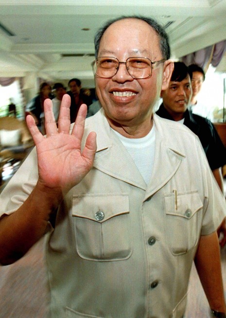The late Khmer Rouge foreign minister Ieng Sary is seen in Phnom Penh in this 1997 file photo. Ieng Sary broke with Pol Pot the previous year, leading his Khmer Rouge forces out of the rebel stronghold of Pailin and over to the government. In the background of the photo is Pol Pot's former bodyguard chief, Y Chhean, who is now the governor of Pailin province. Ieng Sary's son, Ieng Vuth, is Pailin's deputy governor. (Reuters)