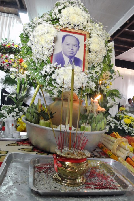 A portrait of the late Ieng Sary, the former Khmer Rouge foreign   minister who passed away on Thursday, sits in front of his coffin at his house in Banteay Meanchey province's Malai district—a former rebel stronghold—where mourners came to pay their respects on Friday. (Simon Lewis/The Cambodia Daily)