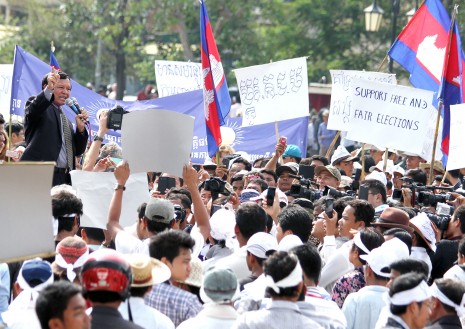Cambodia National Rescue Party vice president Kem Sokha, left, speaks to supporters on Wednesday at a rally in Phnom Penh calling for free and fair national elections. (Siv Channa)