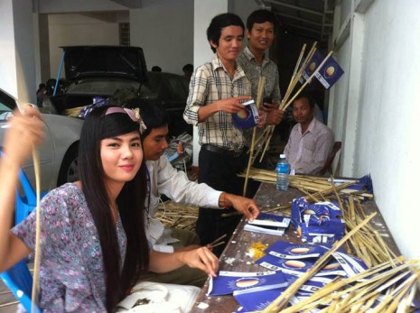 Volunteers prepare promotional flags bearing the logo of the Cambodia National Rescue Party at the party's headquarters in Phnom Penh, in this photo released online by a campaigner on Thursday.