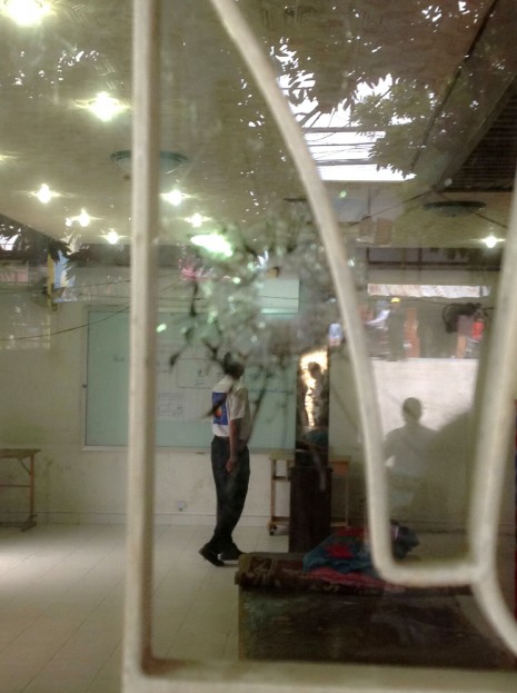 A bullet hole in a glass door at the headquarters of the opposition Cambodia National Rescue Party in Phnom Penh
