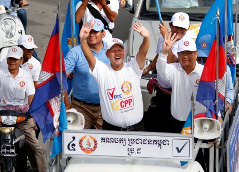 Hun Many, center, the youngest son of Prime Minister Hun Sen and a first-time CPP candidate for the National Assembly, leads a rally of about 10,000 CPP youth supporters through Phnom Penh on Sunday. (Siv Channa)