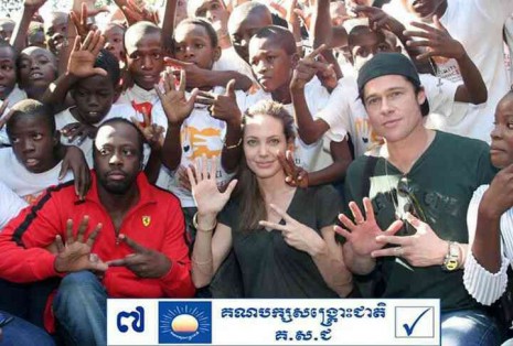 This 2010 photograph has been altered to make it appear Wyclef Jean, left, Angelina Jolie, center, and Brad Pitt support the opposition Cambodia National Rescue Party.