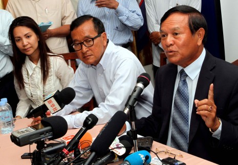 From left, Cambodia National Rescue Party President Sam Rainsy and CNRP Deputy President Kem Sokha hold a press conference on Saturday morning at the opposition’s office in Phnom Penh’s Meanchey district where they warned of possible electoral fraud during Sunday’s vote. (Siv Channa)