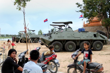 Armored personnel carriers mounted with rocket-firing recoilless guns sit stationed Thursday in Phnom Penh's Sen Sok district. Officials claimed the vehicles were in the capital for repair work. (Siv Channa)
