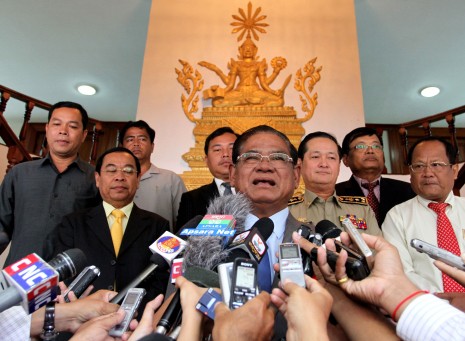 Interior Minister Sar Kheng speaks to reporters Monday, warning of 'trouble' if the CNRP refuses to negotiate over a probe into election irregularities. (Siv Channa)