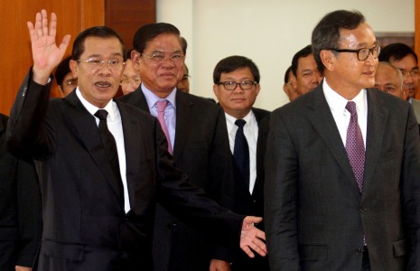 Prime Minister Hun Sen, left, and opposition CNRP leader Sam Rainsy, far right, attend the opening of negotiations in Phnom Penh on Monday, aimed at breaking the political stalemate over July's disputed national election. (Siv Channa)