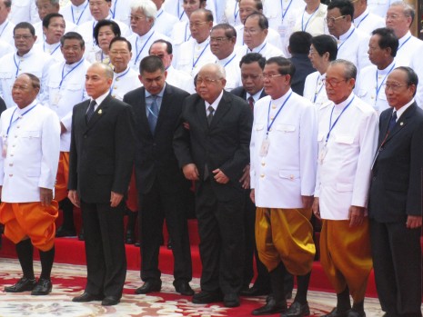 King Norodom Sihamoni, second from left, poses for photographs with Senate president Chea Sim, center, and Prime Minister Hun Sen following the swearing-in ceremony of 68 CPP lawmakers inside the National Assembly on Monday morning. (Colin Meyn/The Cambodia Daily)