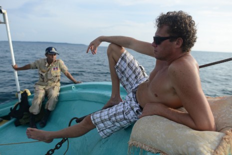 Sergei Polonsky, formerly one of Russia’s richest men, relaxes aboard the Koiyo, a 20-meter Japanese motorboat, on the way to Koh Rong from his private island, Koh Dek Kuol, off the coast of Sihanoukville on Thursday. (Ben Woods/The Cambodia Daily)