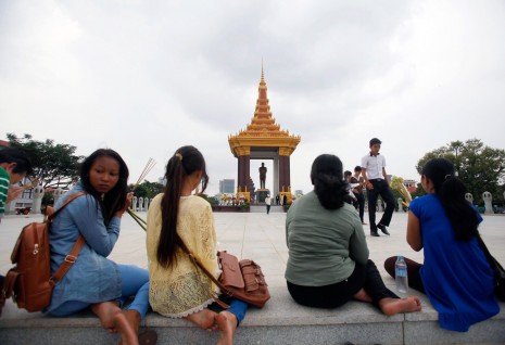 People pay their respects at a statue of the late King Father Norodom Sihanouk in Phnom Penh on Tuesday on the first anniversary of his death. (Reuters)