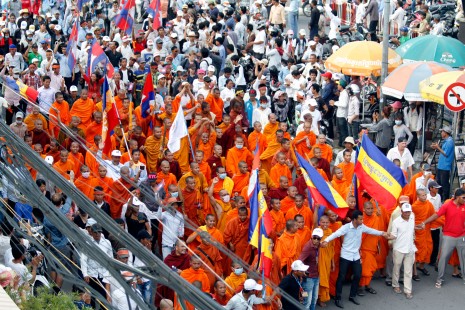 Supporters of the opposition CNRP take part in a march through Phnom Penh on Wednesday to deliver a petition with more than 2 million signatures to the U.N.'s Office of the High Commissioner for Human Rights calling for international intervention in the country's post-election dispute. (Siv Channa)