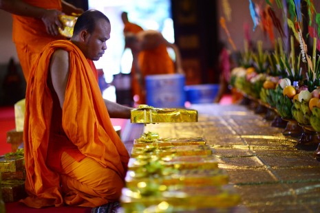 A monk at Wat Lanka in Phnom Penh arranges gifts on a table on Thursday after the Bos Bay Ben ceremony, when offerings to both good and bad ghosts are blessed as part of the 15-day Pchum Ben festival. (Lauren Crothers)