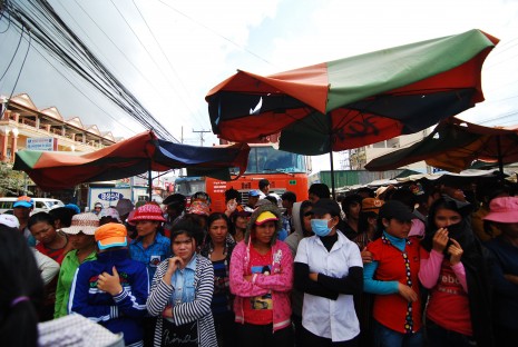 Workers from Alim Cambodia Co. Ltd. garment factory protest for higher wages in Phnom Penh's Pur Senchey district Wednesday. (Lauren Crothers/ The Cambodia Daily)