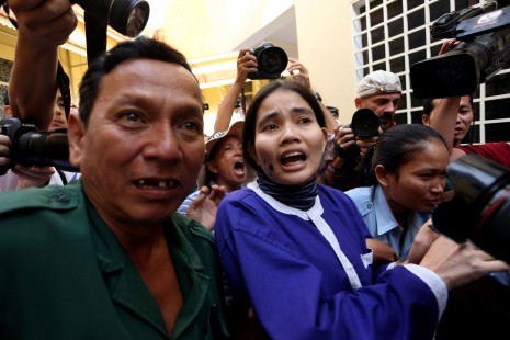 Anti-eviction activist Yorm Bopha is led away from the courtroom after a panel of Supreme Court judges on Friday ordered that she be released on bail while her case is sent back to the Appeal Court for reinvestigation. (Siv Channa)