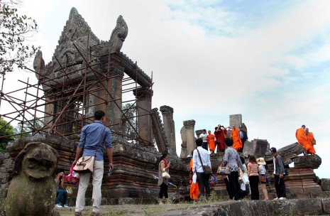 Tourists and monks tour Preah Vihear Sunday, ahead of Monday's ruling by the International Court of Justice on whether Thailand or Cambodia owns a disputed 4.6-square-km area next to the temple. (Siv Channa)