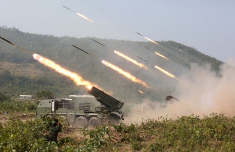 Truck-mounted missile launchers release volleys of rockets on Monday during an extensive live-fire weapons exercise at the Royal Cambodian Armed Forces' tank command headquarters in Kompong Speu province. (Siv Channa)