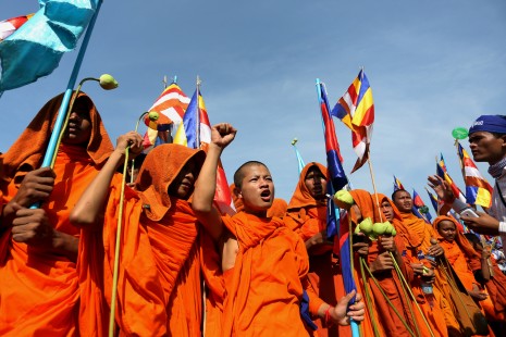 Monks rally Tuesday outside the National Assembly to mark International Human Rights Day despite the municipality prohibiting them from marching in the city. Hundreds of monks and their supporters gathered outside the Assembly on the last day of a 10-day trek to Phnom Penh during which they collected petitions documenting human rights abuses. (Siv Channa)