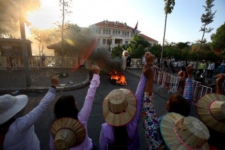 Women protesting the eviction of thousands of families from Phnom Penh's Boeng Kak neighborhood set fire to tires Wednesday in front of City Hall during their third straight day of demonstrations. (Siv Channa)