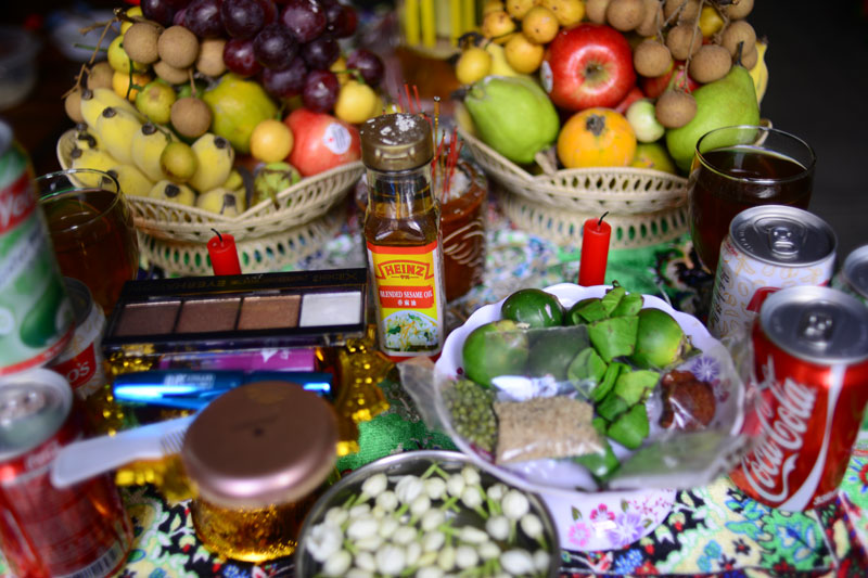 Sesame oil, cosmetics and other offerings are put on display in a family home in Phnom Penh on the first day of the Khmer New Year yesterday. Around the country, people prepared altars to Koreakeak Devi, one of seven New Year's angels. (Lauren Crothers/The Cambodia Daily)