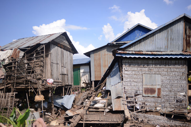 A house in Russei Keo district's Prek Tasek commune lies in ruins Wednesday after it collapsed in strong winds on Tuesday night, killing a woman and her daughter. (Lauren Crothers/The Cambodia Daily)
