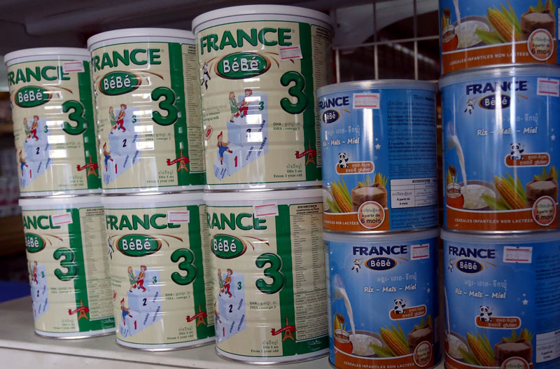 Cans of France Bebe baby formula are seen on the shelves of a pharmacy in Phnom Penh. (Siv Channa)