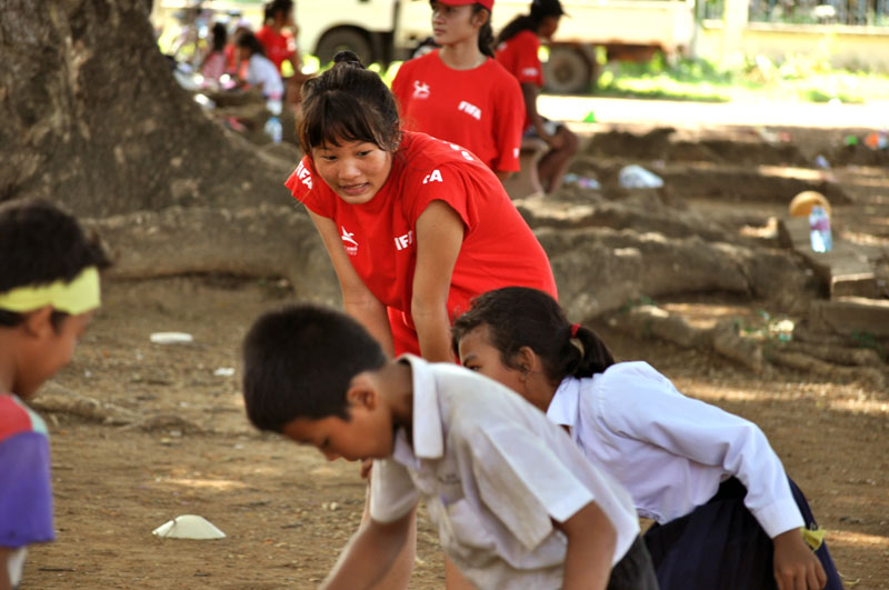 Kimhong, one of SALT Academy's 'Mighty Girls' coaches, instructs children in Battambang province on Saturday. (Abigail Drollinger)