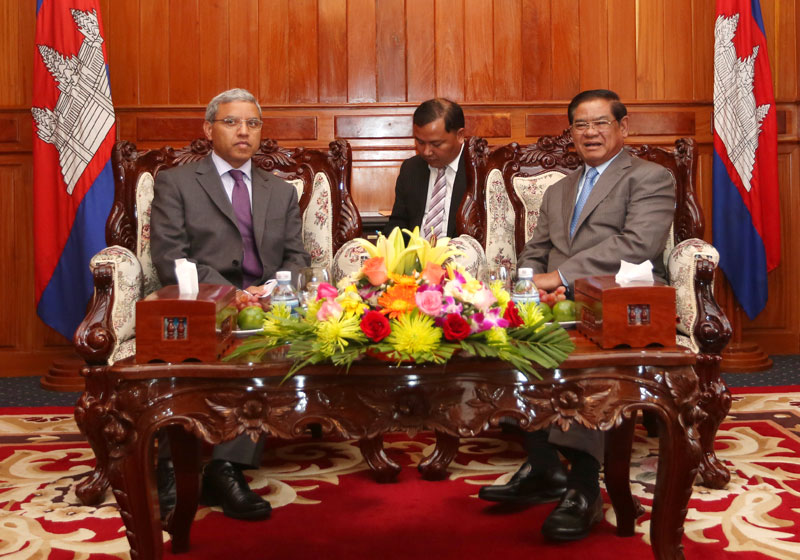 Surya Subedi, left, the UN's human rights envoy to Cambodia, meets with Interior Minister Sar Kheng on Friday as part of his 11th mission to the country. Mr. Subedi is scheduled to report to the UN on the country's human rights situation later this year. (Siv Channa/The Cambodia Daily)