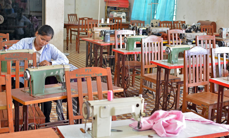 Phon Srim practices sewing during a tailoring class at Kompong Cham's provincial vocational training center on Tuesday. (Alex Consiglio/The Cambodia Daily)