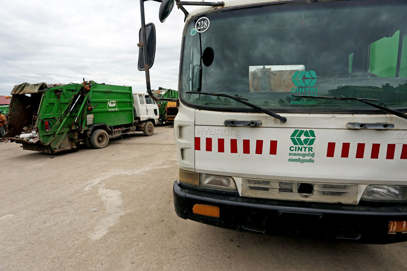 Cintri garbage trucks sit idle in the company's depot in Dangkao district as staff at the firm went on strike. (Siv Channa/The Cambodia Daily)