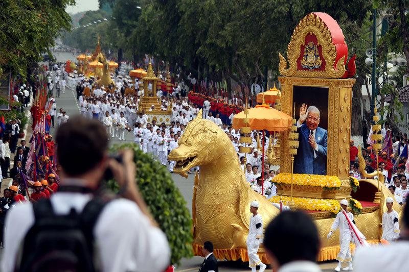 A parade to commemorate the interring of late King Father Norodom Sihanouk's ashes makes its way through Phnom Penh on Friday morning. (Siv Channa/The Cambodia Daily)