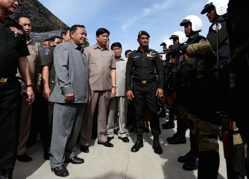 Phnom Penh Governor Pa Socheatvong, left, inspects military police officers during a ceremony on Thursday in which he handed out about $30,000 to the force as a reward for what he called its 'perfect' performance over the last year. (Siv Channa/The Cambodia Daily)