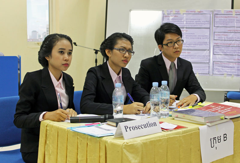 Young Lawyers Face a Future in Corrupt Courts 1 Law students (left to right) Ros Sereysocheata, Sem Sereyrachana and Chan Sokhay, from the Royal University of Law and Economics, listen to the defense counsel during the eighth annual mock trial competition at Phnom Penh International University on Thursday. (Holly Robertson/The Cambodia Daily)