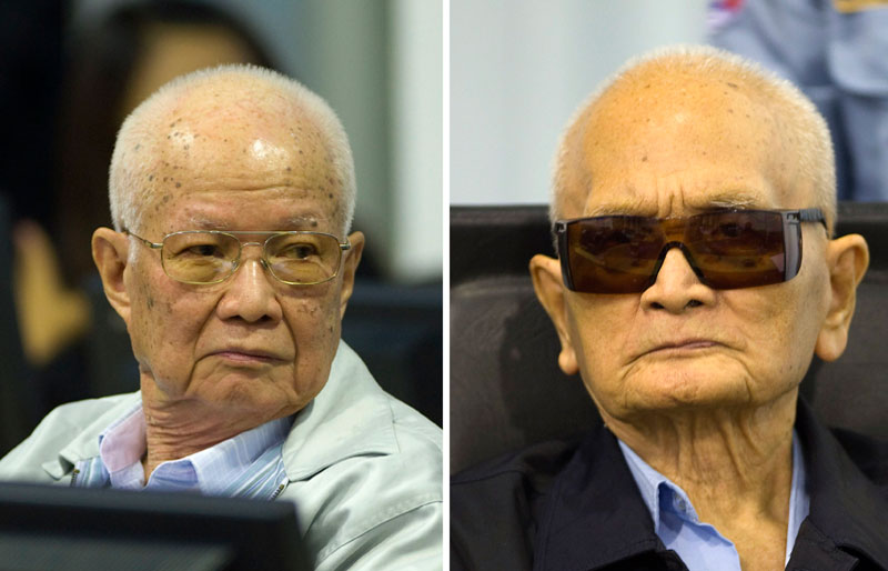 Former Khmer Rouge head of state Khieu Samphan, left, and "Brother Number Two" Nuon Chea sit at the Extraordinary Chambers in the Courts of Cambodia as their verdicts were delivered on Thursday morning. (Mark Peters/ECCC)