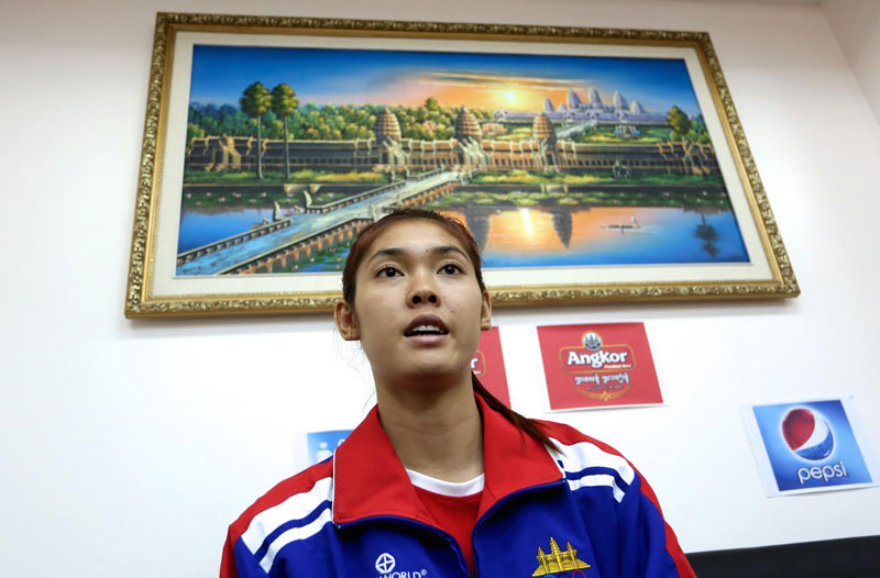 Asian Games taekwondo gold medalist Sorn Seavmey speaks to reporters at the National Olympic Committee of Cambodia’s Phnom Penh headquarters earlier this month. (Siv Channa/The Cambodia Daily)