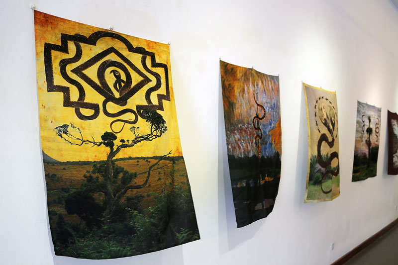 Pieces from Bruce Gundersen's 'Beyond the Rational Horizon' exhibition, which opened this week, hang in the gallery at Meta House. (Aria Danaparamita/The Cambodia Daily)