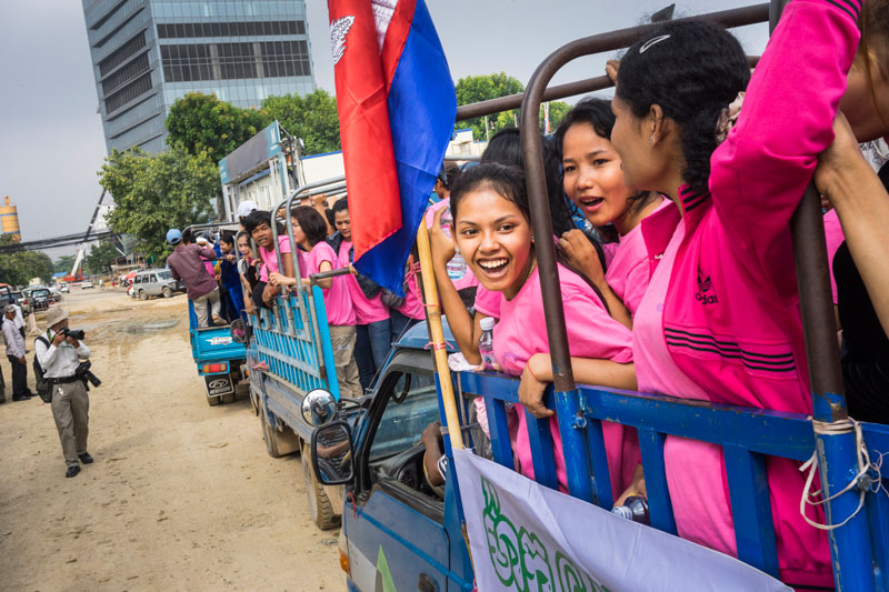 Garment workers arrive in central Phnom Penh on Sunday for a rally to demand a higher minimum wage. (John Vink)