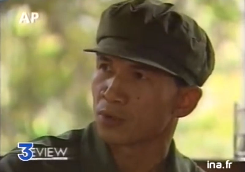 Tep Khunnal is interviewed by American journalist Nate Thayer in Anlong Veng in a segment aired on French television after the Khmer Rouge ousted Pol Pot in a show trial in July 1997. (France 3 Television)