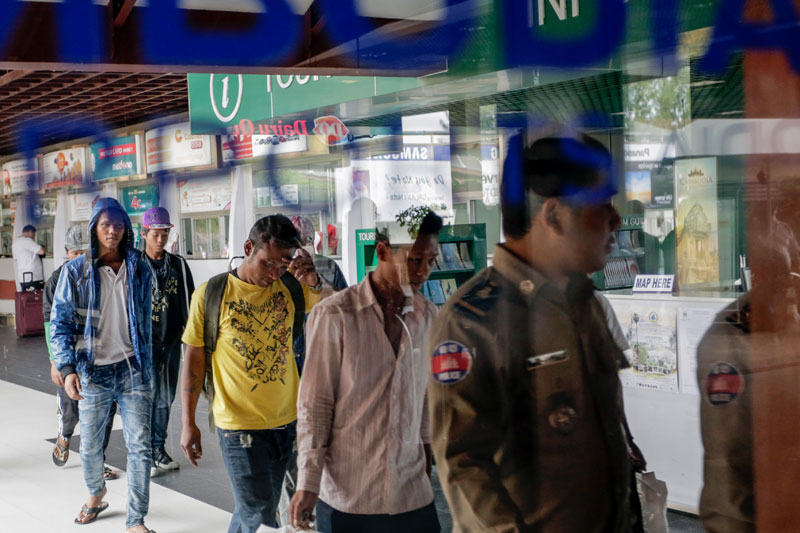 Cambodian fishermen arrive at Phnom Penh International Airport on Wednesday, following their rescue from a Thai fishing boat off the coast of Indonesia. (Siv Channa/The Cambodia Daily)