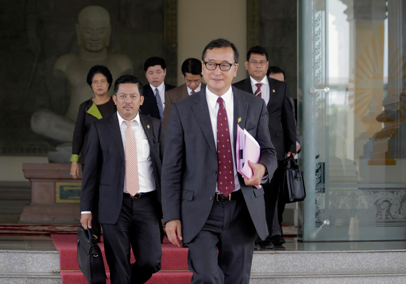 Opposition leader Sam Rainsy leads a group of CNRP lawmakers out of the National Assembly on Monday. (Siv Channa/The Cambodia Daily) 