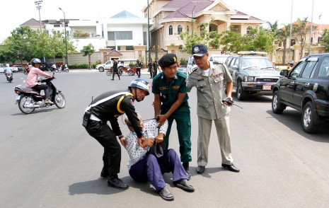 A protester from Phnom Penh's Boeng Kak community is moved after clashing with security forces on Monday. (Siv Channa)