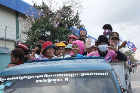 A truck carries garment factory workers to their accommodations after finishing their shift in Phnom Penh's Meanchey district. (Luke Radcliff/The Cambodia Daily)