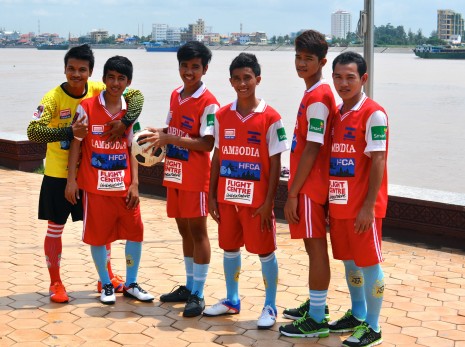 The six members of Cambodia's national homeless football team pose for photos in Phnom Penh on Wednesday. (Simon Henderson/The Cambodia Daily)