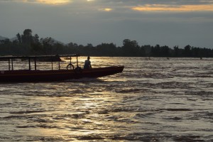 A ferryboat crosses the Hou Phapheng river, a channel of the Mekong River in Laos, near to where the Don Sahong hydropower dam is slated to be built. (Nontarat Phaicharoen)