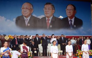 Prime Minister Hun Sen, center, and CPP National Assembly President Heng Samrin release doves at a 2014 ceremony on Koh Pich in Phnom Penh to mark the 35th anniversary of the fall of the Khmer Rouge on January 7, 1979. (Siv Channa)