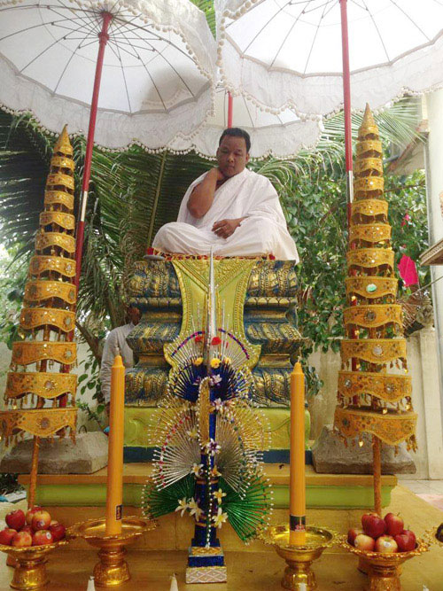 Thean Vuthy, who claims to be a reincarnation of the Buddha, sits on a throne in this photo circulating on social media.