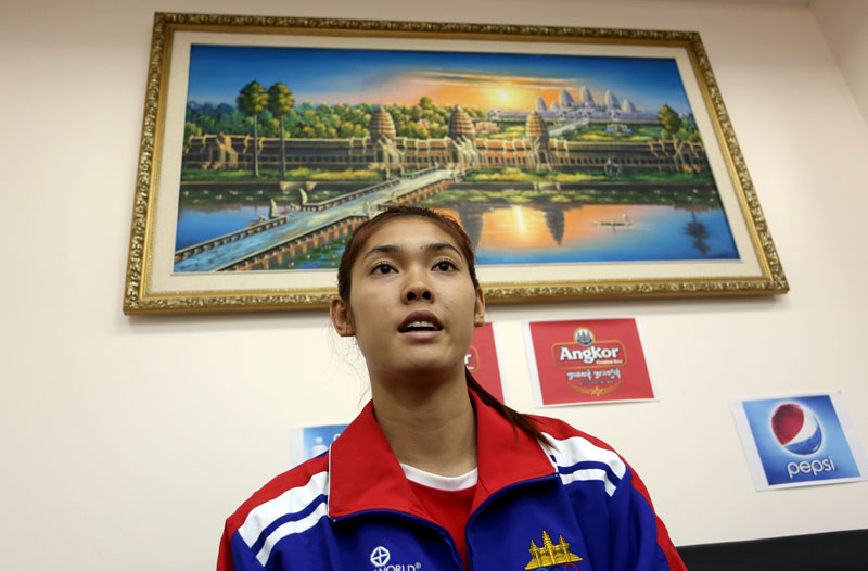 Asian Games taekwondo gold medalist Sorn Seavmey speaks to reporters at the National Olympic Committee of Cambodia’s Phnom Penh headquarters on Tuesday. (Siv Channa/The Cambodia Daily)
