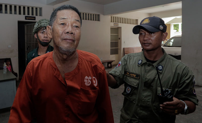Ly Sreang Kheng leaves the Phnom Penh Municipal Court on Thursday. (Siv Channa/The Cambodia Daily)