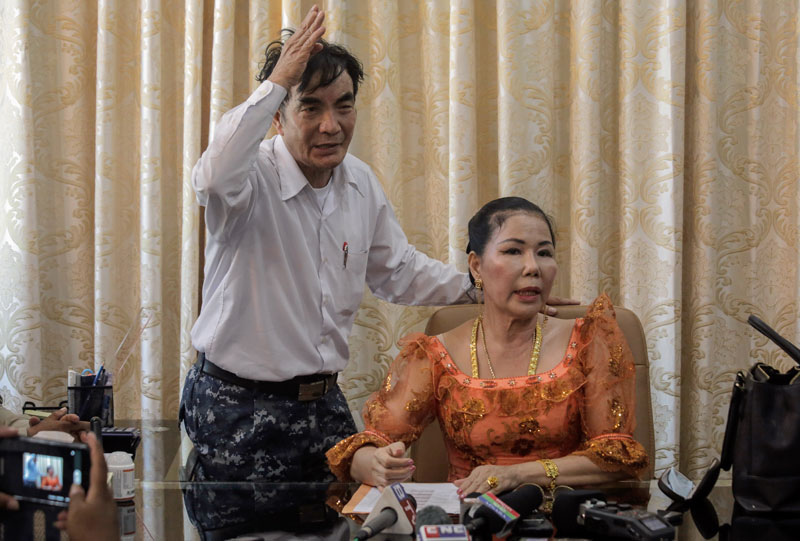 Thong Chamroeun, left, and Keo Sary, the parents of Major General Thong Sarath, speak during a press conference at their home in Phnom Penh's Meanchey district on Wednesday, hours before being apprehended by police. (Siv Channa/The Cambodia Daily)